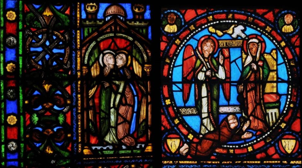 Stained glass windows with religious figures.